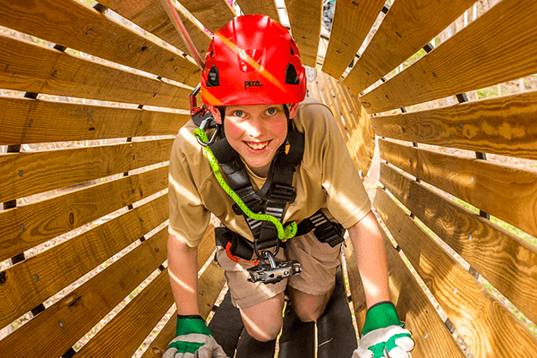 Boy crawls through tunnel